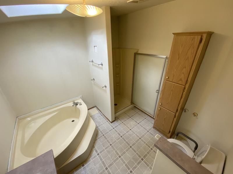 Before: corner tub and old tile