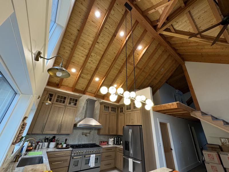 Kitchen under a tongue-and-groove ceiling