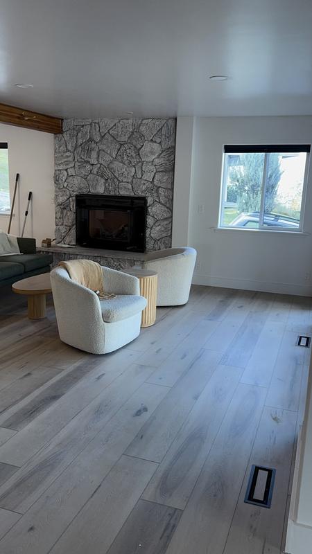 Living room with a stone fireplace