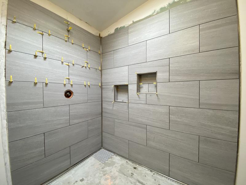Large-format tile going up