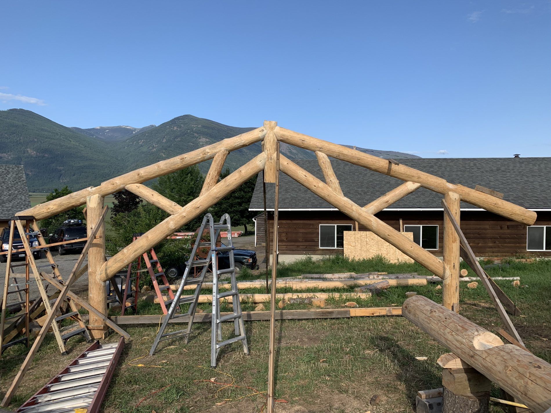 Reverse scissor log truss set in place